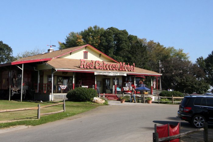 We pass the Red Caboose Motel as we pull out of the station